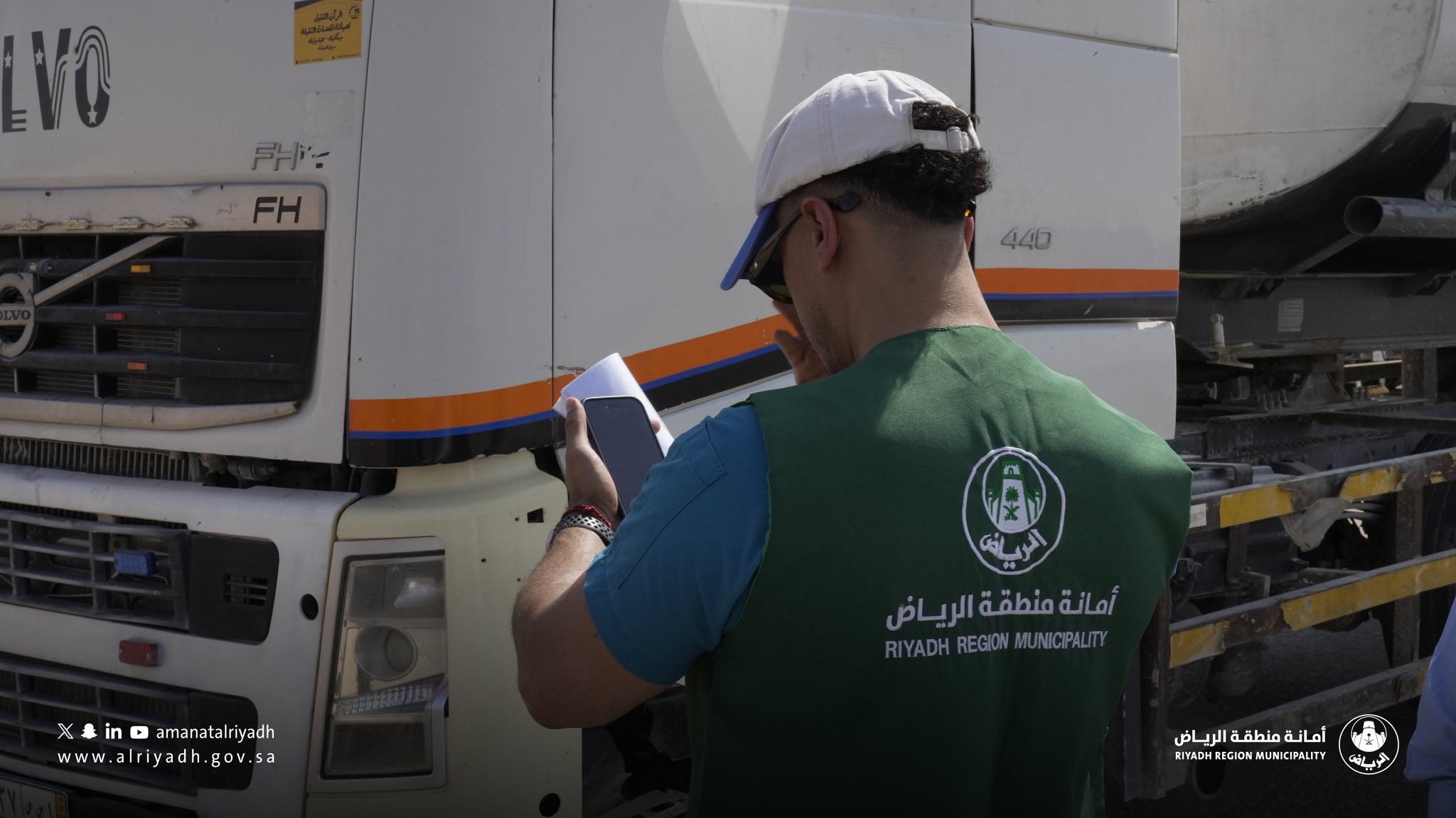 Riyadh Municipality inspector checking a construction waste truck