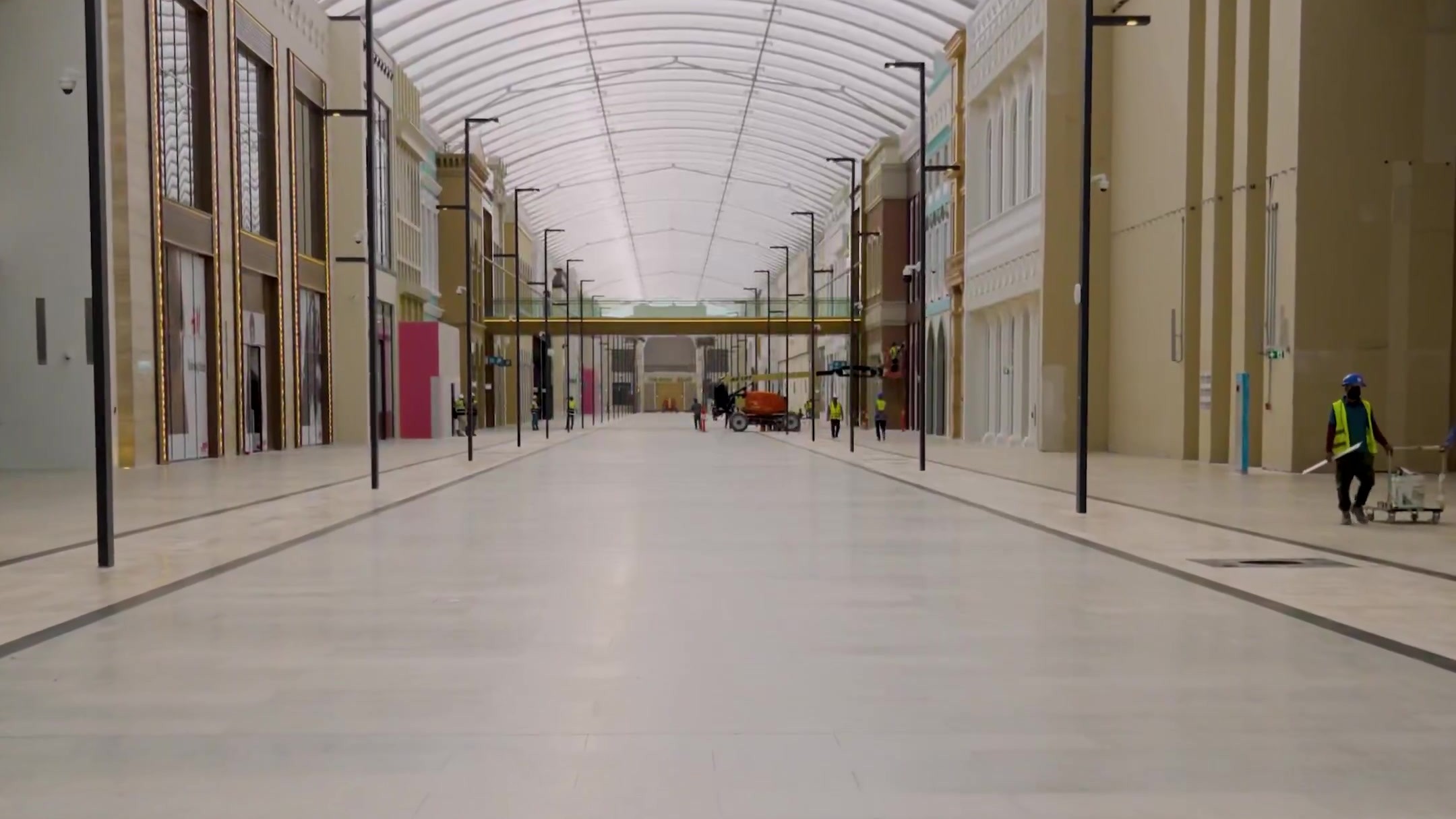 Vaulted, glass-roofed street inside The Avenues Riyadh during construction