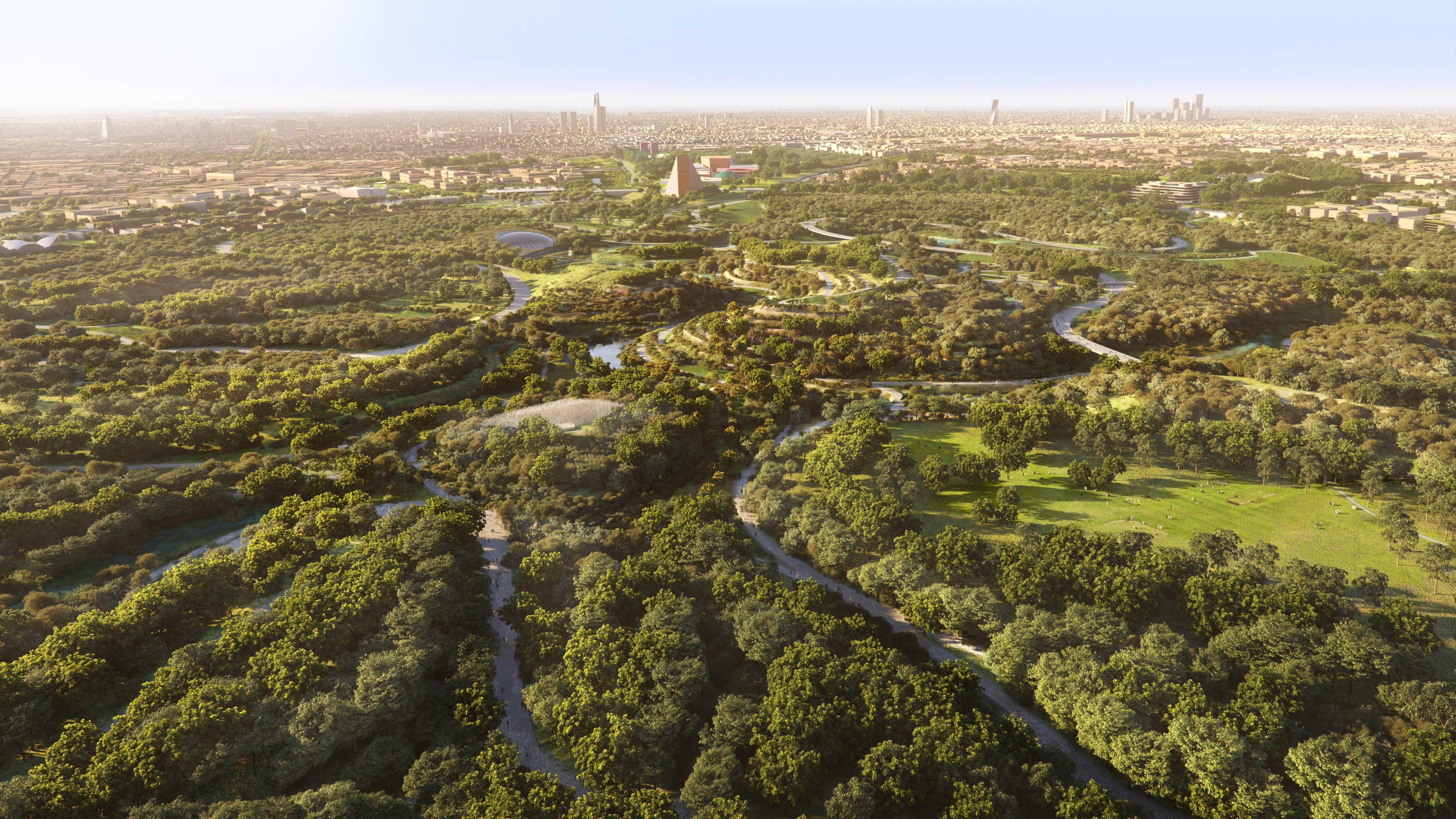 Landscape render of King Salman Park in Riyadh with dense tree canopy and the city skyline beyond