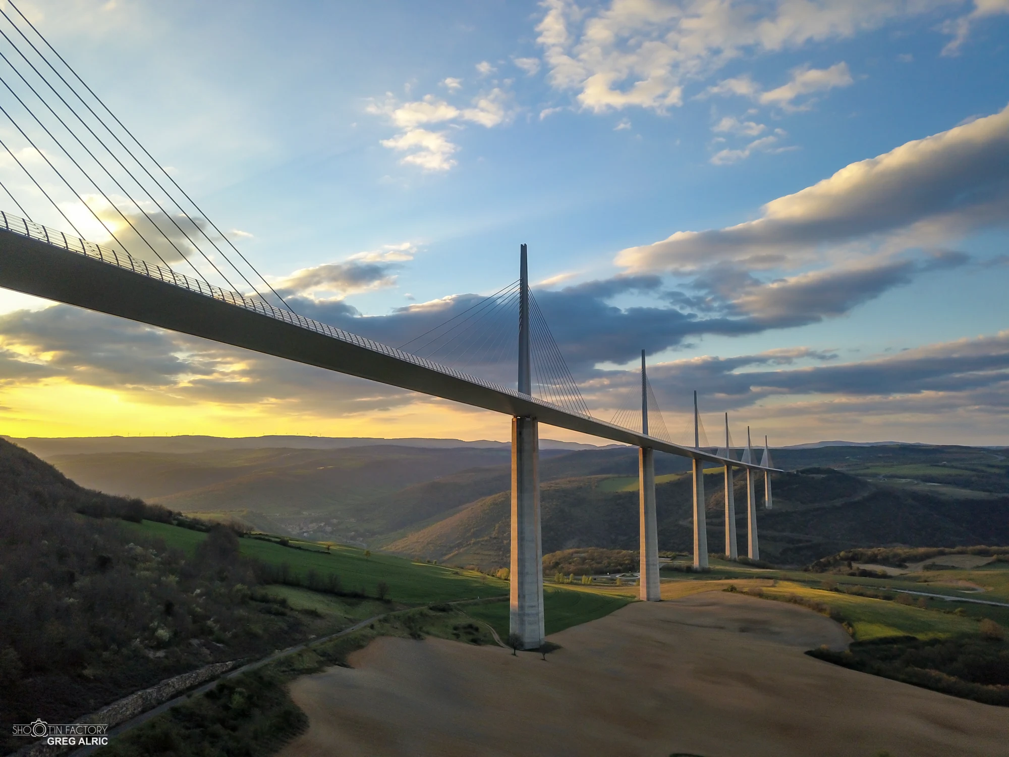The Millau Viaduct crossing the Tarn valley at sunset