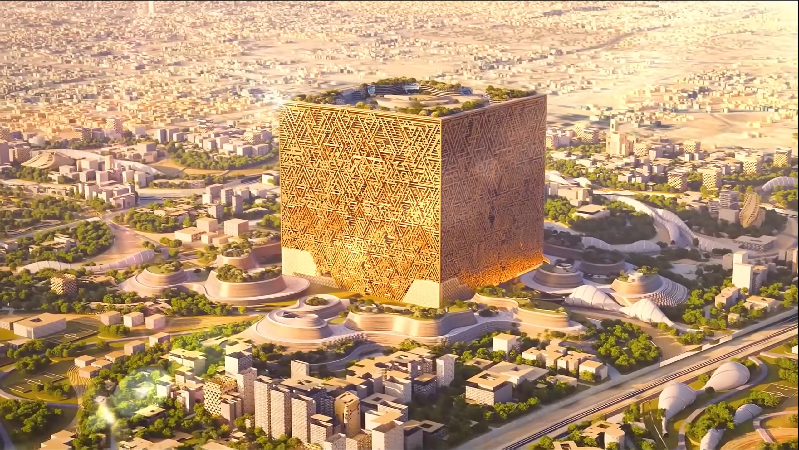 رسم توضيحي جوي للمكعب، مبنى مكعب ضخم بواجهة ذهبية هندسية، يرتفع فوق حي المربع الجديد في الرياض