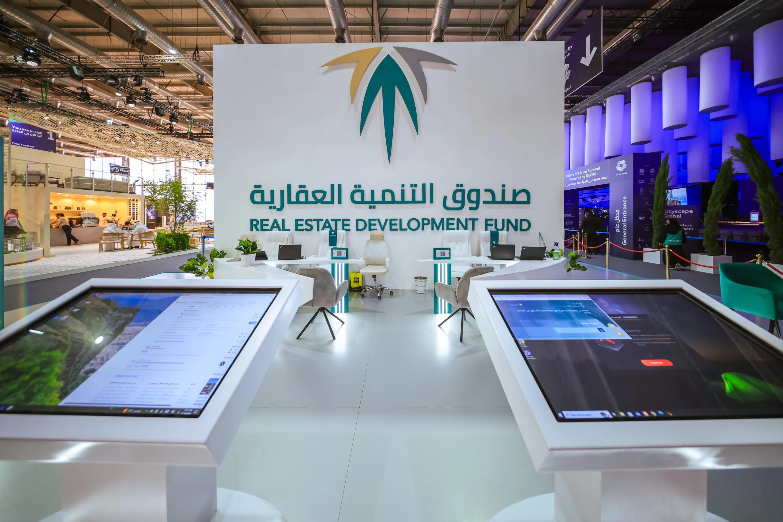 The Real Estate Development Fund booth at Cityscape, with the fund's logo and name