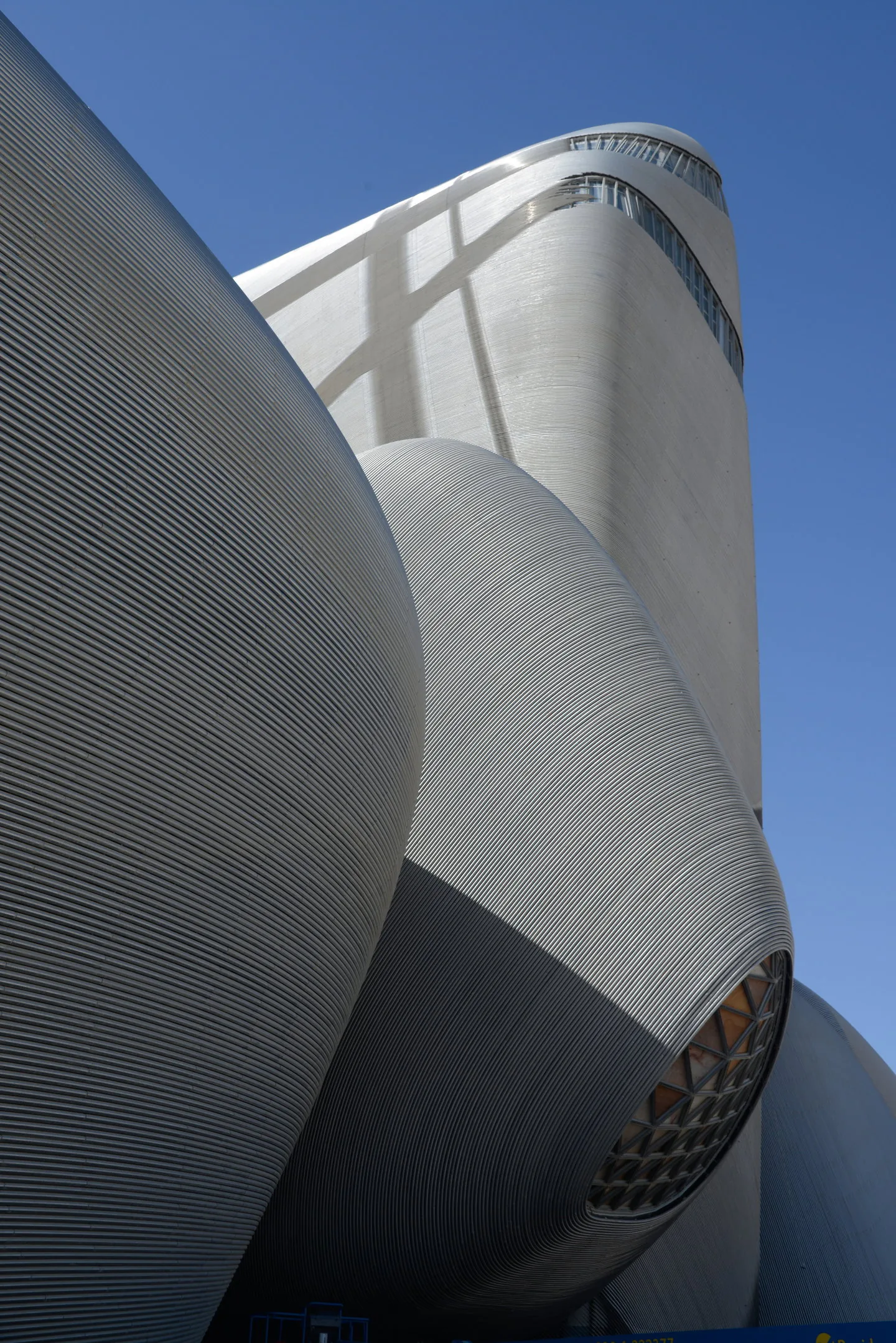The tower and pebbles clad in bent steel tubes