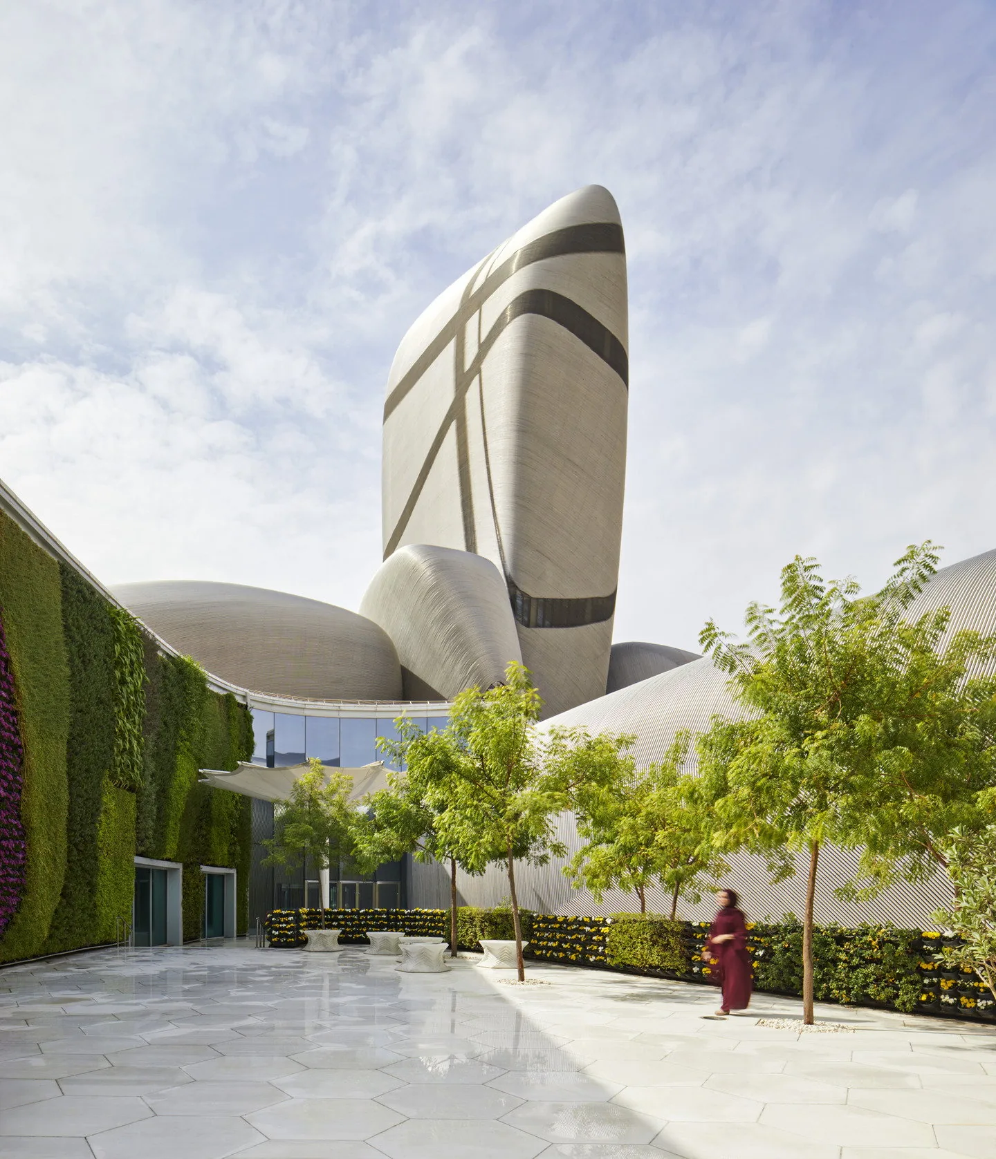 The tower above the garden plaza and green wall